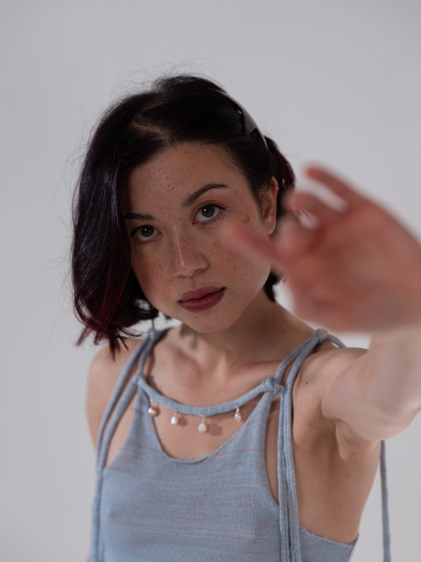 Handknitted top with pearl embelishment