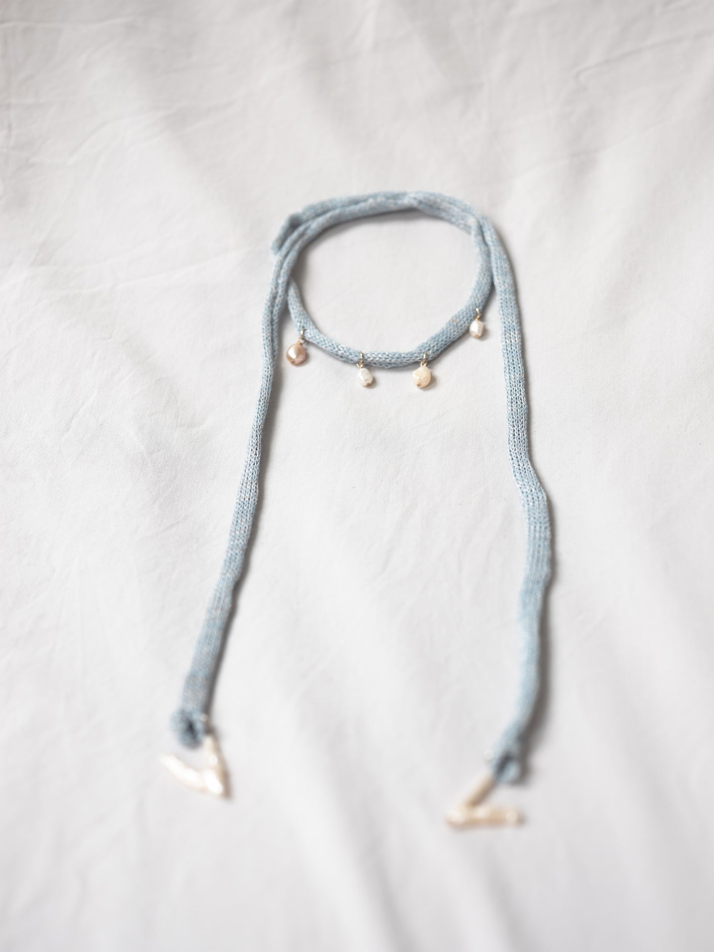Handknitted top with pearl embelishment